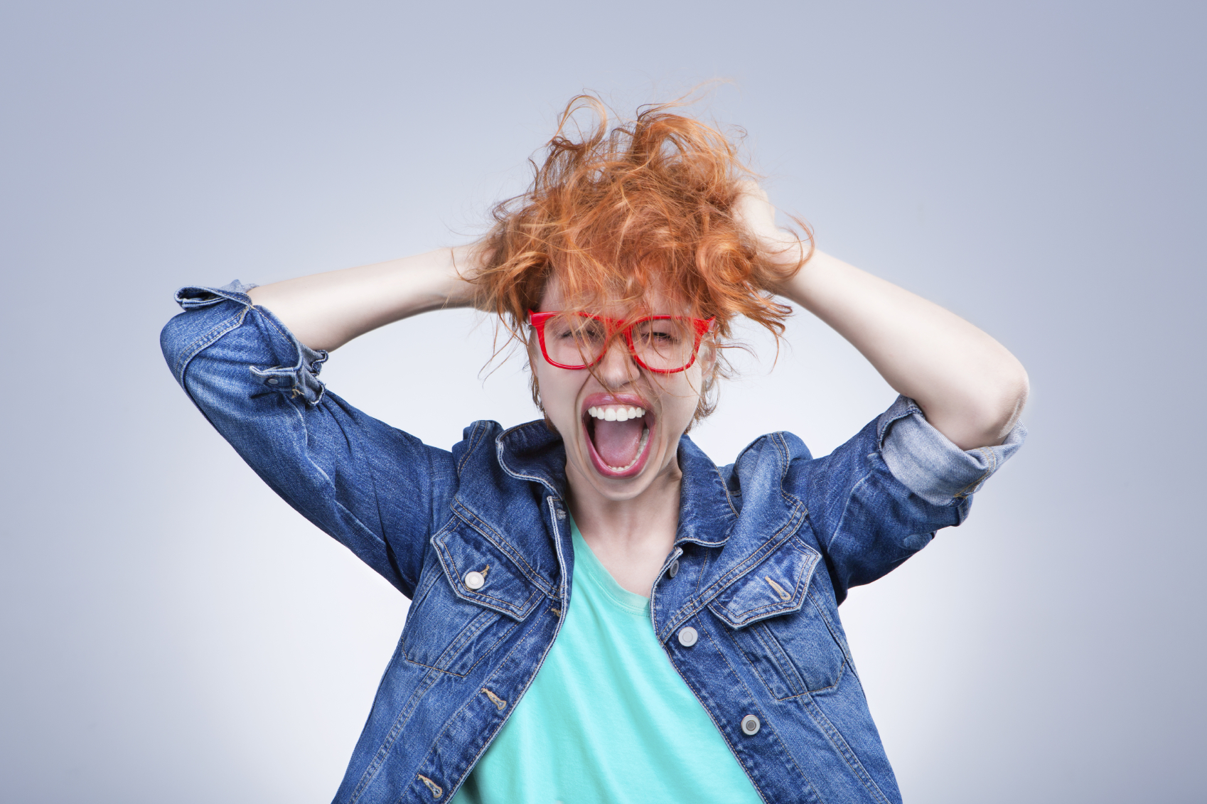 Frustrated woman pulling at her hair
